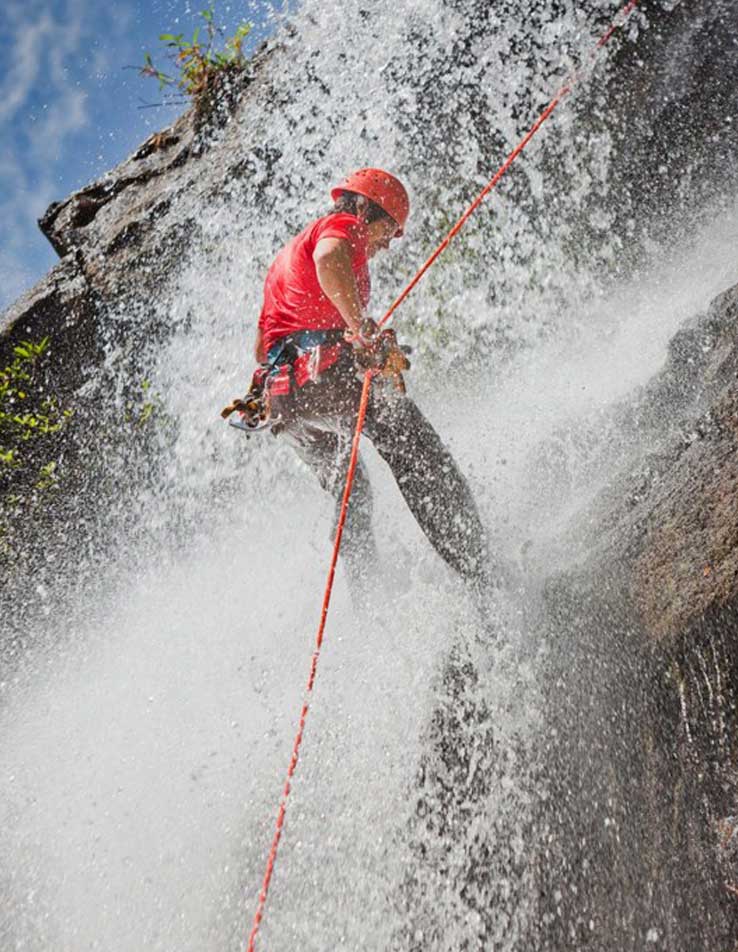 Waterfall-rappeling Rappelling during one of our tour packages to Belize